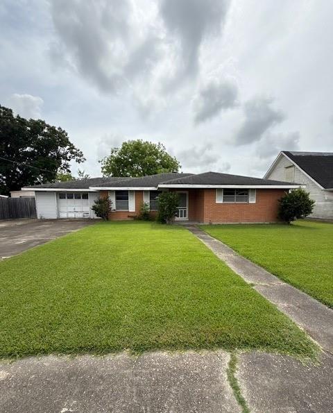 2258 General Collins Ave, New Orleans, LA 70114 - ranch-style home with driveway and an attached garage