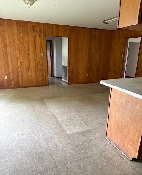 2258 General Collins Ave, New Orleans, LA 70114 - unfurnished room with wooden walls