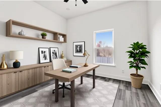 office space featuring ceiling fan, wood finished floors, and baseboards
