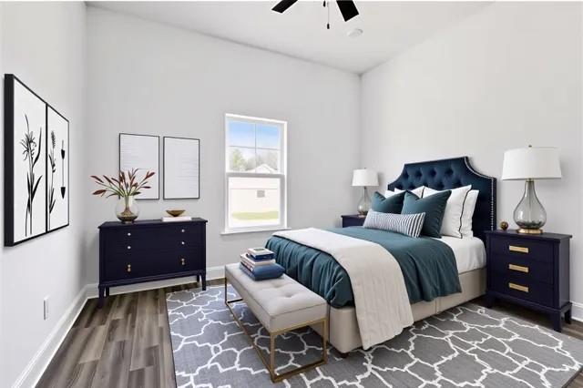 bedroom featuring wood finished floors, baseboards, and a ceiling fan