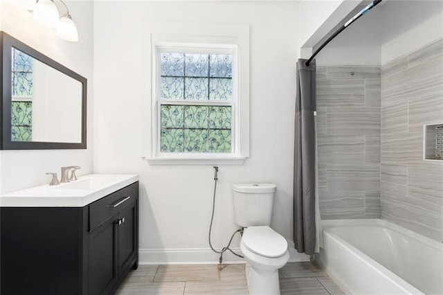 bathroom with baseboards, vanity, toilet, and shower / bathtub combination with curtain
