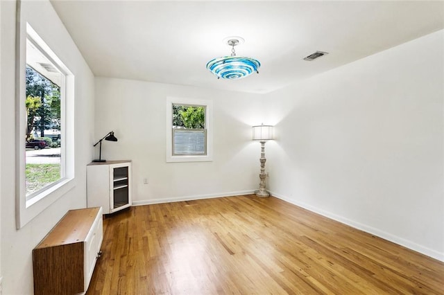 527 S Filmore St, Covington, LA 70433 - spare room featuring healthy amount of natural light, light wood-type flooring, and baseboards