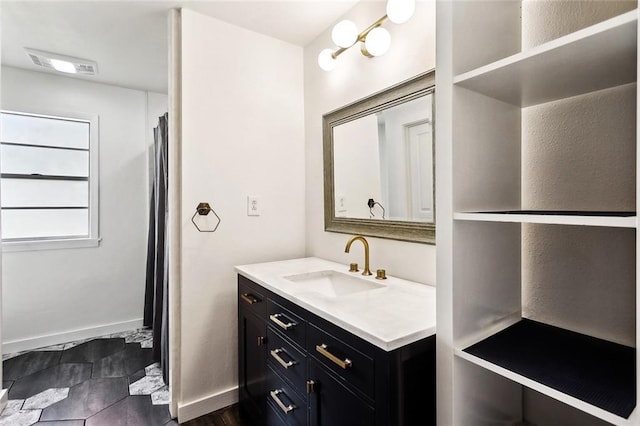 527 S Filmore St, Covington, LA 70433 - full bathroom with vanity and baseboards