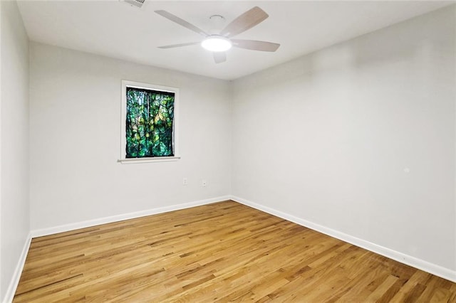 527 S Filmore St, Covington, LA 70433 - spare room with light wood-type flooring, baseboards, and a ceiling fan