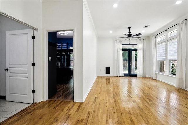 527 S Filmore St, Covington, LA 70433 - unfurnished living room with light wood-style floors, a ceiling fan, ornamental molding, baseboards, and recessed lighting