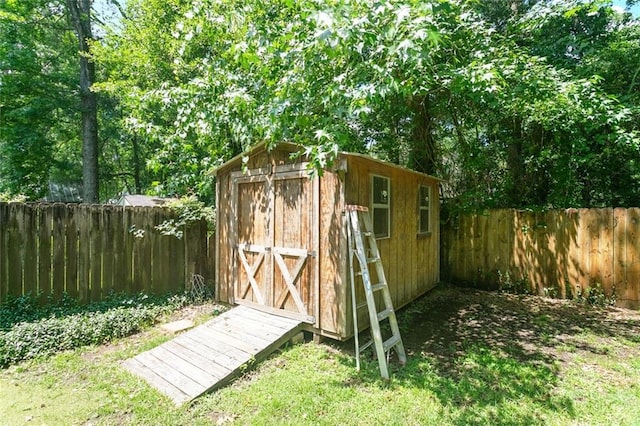 527 S Filmore St, Covington, LA 70433 - view of shed with a fenced backyard
