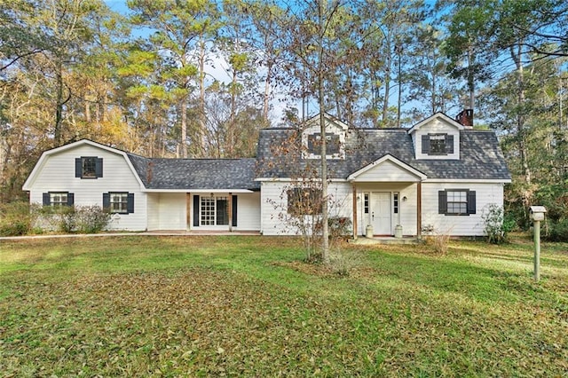 19635 Sunshine Ave, Covington, LA 70433 - colonial inspired home with a front yard, a chimney, a gambrel roof, and roof with shingles