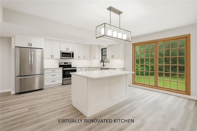 19635 Sunshine Ave, Covington, LA 70433 - kitchen with stainless steel appliances, tasteful backsplash, light wood-style flooring, and light countertops