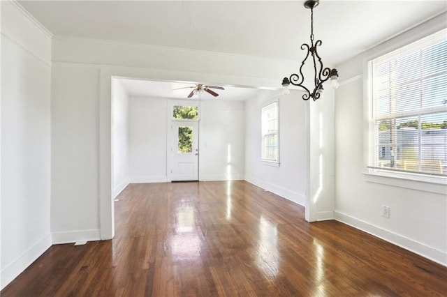 629 Lesseps St, New Orleans, LA 70117 - unfurnished dining area with dark wood-type flooring, ceiling fan, and baseboards