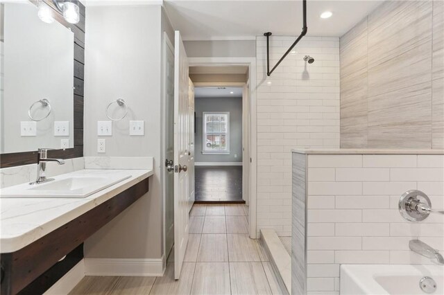 629 Lesseps St, New Orleans, LA 70117 - full bathroom featuring baseboards, vanity, and recessed lighting
