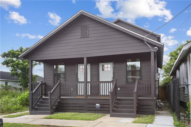 240810 Saint Anthony St, New Orleans, LA 70119 - view of front of property with covered porch and fence