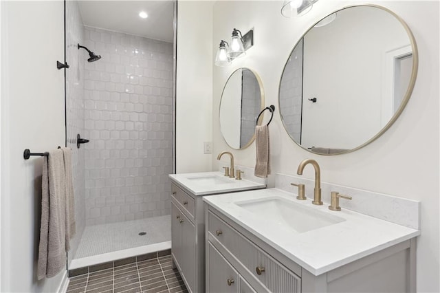 240810 Saint Anthony St, New Orleans, LA 70119 - bathroom with a tile shower, recessed lighting, two vanities, and tile patterned floors