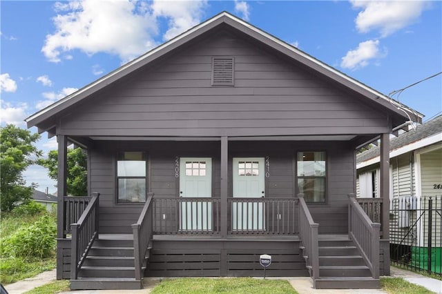 240810 Saint Anthony St, New Orleans, LA 70119 - view of front of home featuring a porch