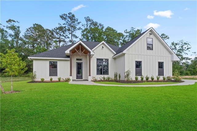 43448 Springwood Way, Hammond, LA 70401 - modern farmhouse with a front lawn, board and batten siding, and a shingled roof