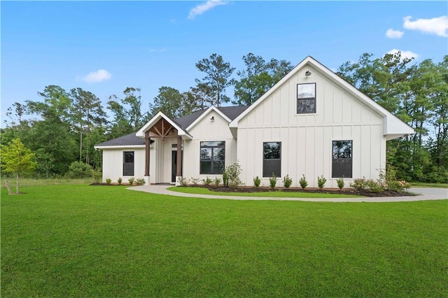 43448 Springwood Way, Hammond, LA 70401 - modern farmhouse style home featuring board and batten siding and a front lawn