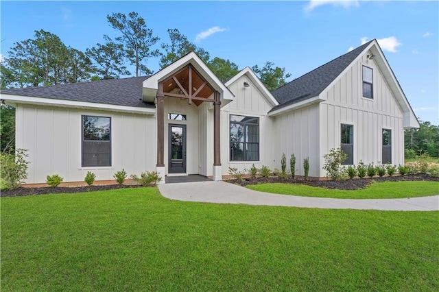 43448 Springwood Way, Hammond, LA 70401 - modern farmhouse style home featuring board and batten siding, a front lawn, and roof with shingles