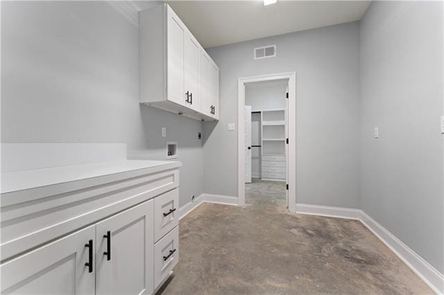 43448 Springwood Way, Hammond, LA 70401 - laundry area with electric dryer hookup, cabinet space, and hookup for a washing machine