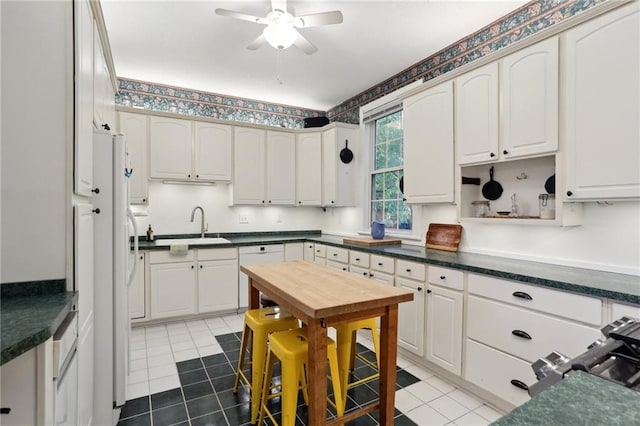 2224 Dumaine St, New Orleans, LA 70119 - kitchen featuring white appliances, a sink, tile patterned floors, and ceiling fan