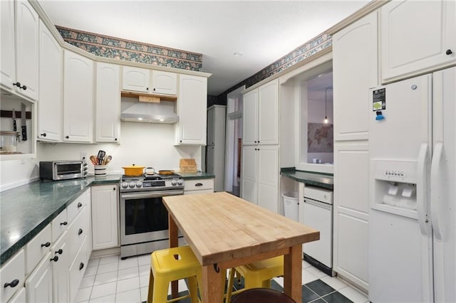 2224 Dumaine St, New Orleans, LA 70119 - kitchen with stainless steel gas range oven, white refrigerator with ice dispenser, ventilation hood, light tile patterned floors, and dark countertops
