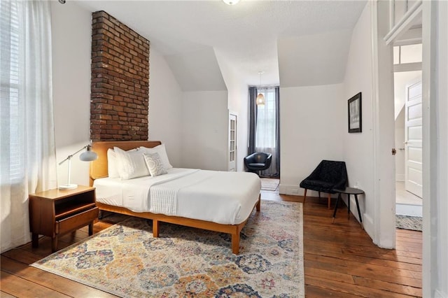 2224 Dumaine St, New Orleans, LA 70119 - bedroom with hardwood / wood-style floors and vaulted ceiling