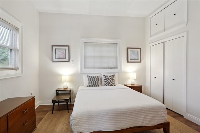 2224 Dumaine St, New Orleans, LA 70119 - bedroom featuring wood finished floors, a closet, and baseboards