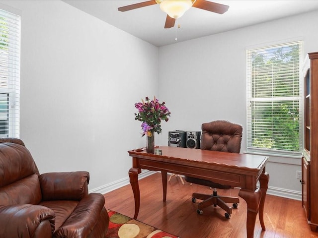 5840 Eads St, New Orleans, LA 70122 - home office featuring a ceiling fan, light wood-type flooring, and plenty of natural light