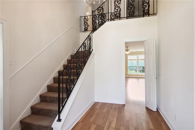 5120 Belle Dr, Metairie, LA 70006 - staircase with wood finished floors, baseboards, and ceiling fan