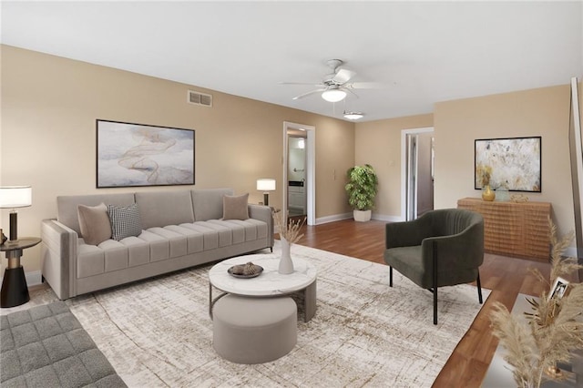 5120 Belle Dr, Metairie, LA 70006 - living area featuring wood finished floors, a ceiling fan, and baseboards