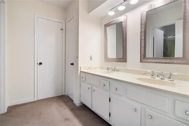 5120 Belle Dr, Metairie, LA 70006 - bathroom featuring double vanity and baseboards