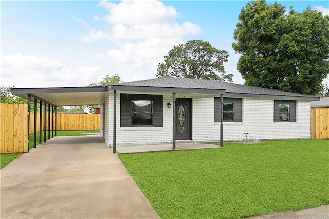 view of front of property with concrete driveway, a carport, brick siding, and a shingled roof