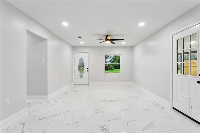entrance foyer with a ceiling fan, recessed lighting, baseboards, and light marble finish floors