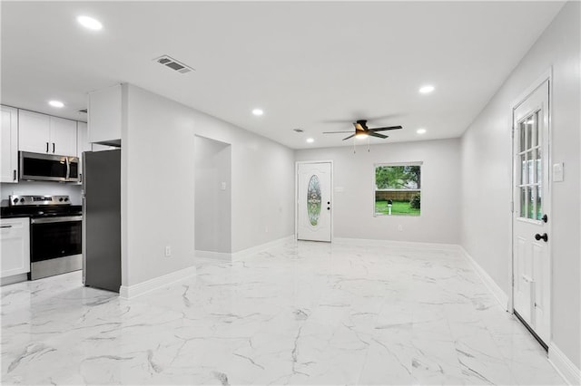 unfurnished living room with recessed lighting, ceiling fan, baseboards, and light marble finish flooring
