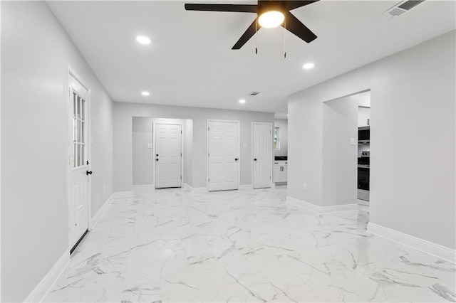 empty room featuring recessed lighting, ceiling fan, baseboards, and light marble finish floors