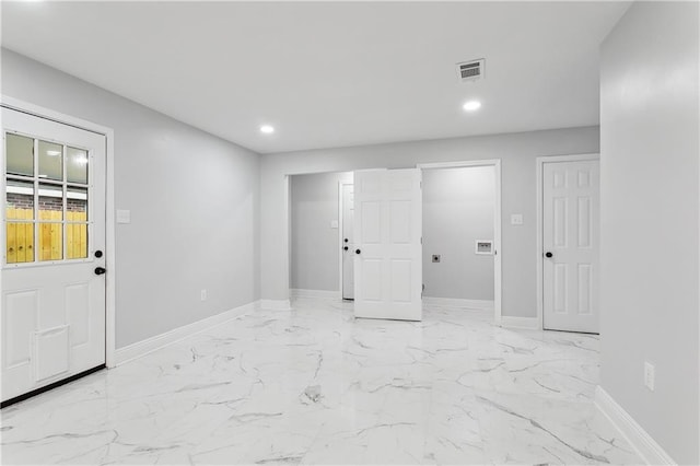 unfurnished room featuring baseboards, recessed lighting, and light marble finish floors
