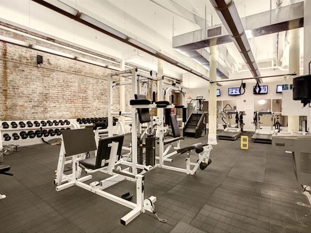workout area with brick wall