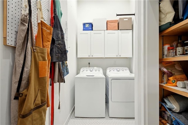 3217 Dauphine St, New Orleans, LA 70117 - clothes washing area with washing machine and dryer, cabinet space, and baseboards