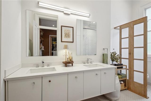3217 Dauphine St, New Orleans, LA 70117 - bathroom featuring double vanity and a shower