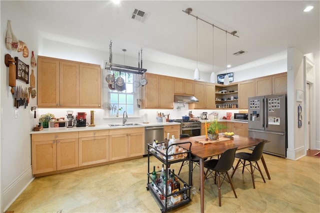 3217 Dauphine St, New Orleans, LA 70117 - kitchen with stainless steel appliances, under cabinet range hood, a sink, open shelves, and light brown cabinetry