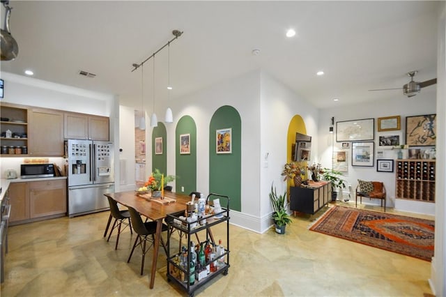 3217 Dauphine St, New Orleans, LA 70117 - dining space featuring arched walkways, ceiling fan, and recessed lighting