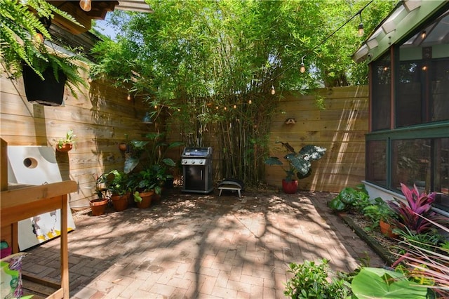 3217 Dauphine St, New Orleans, LA 70117 - view of patio featuring grilling area and fence