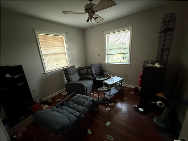 sitting room featuring ceiling fan, baseboards, and wood finished floors