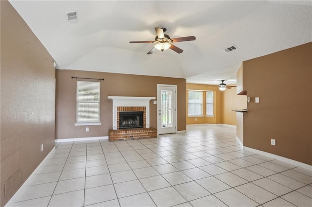 2728 Sprig Dr, Marrero, LA 70072 - unfurnished living room featuring a fireplace, ceiling fan, vaulted ceiling, and light tile patterned floors