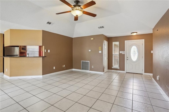 2728 Sprig Dr, Marrero, LA 70072 - entryway with ceiling fan, lofted ceiling, light tile patterned flooring, and baseboards