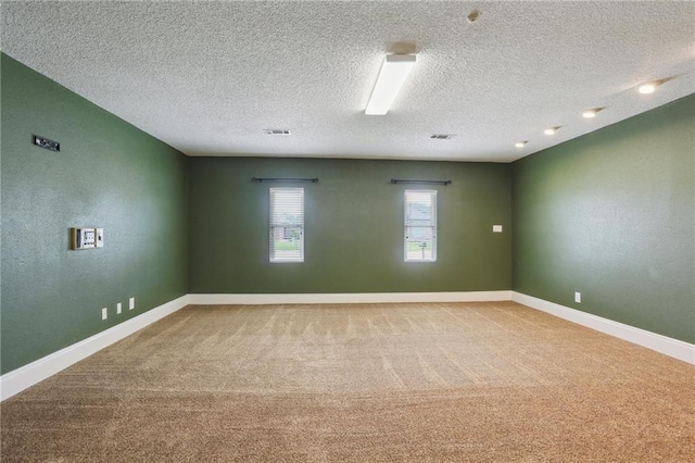2728 Sprig Dr, Marrero, LA 70072 - carpeted spare room featuring a textured ceiling and baseboards