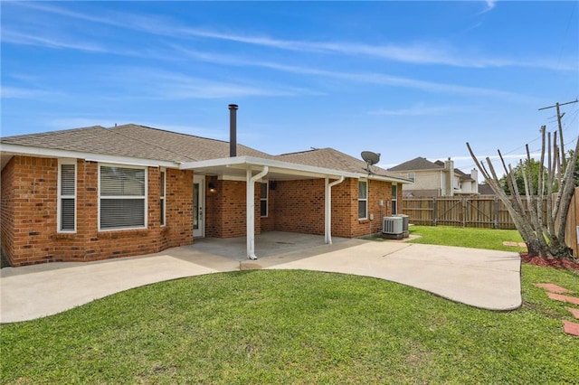 2728 Sprig Dr, Marrero, LA 70072 - rear view of property featuring a patio, brick siding, central AC unit, and roof with shingles