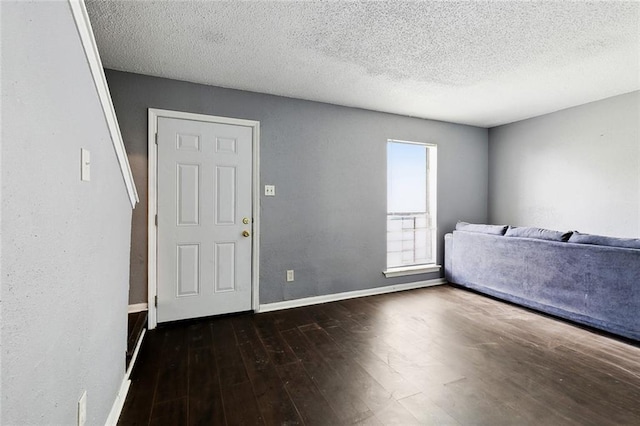 27 Pinewood Ct, New Orleans, LA 70114 - entrance foyer with wood finished floors, baseboards, and a textured ceiling
