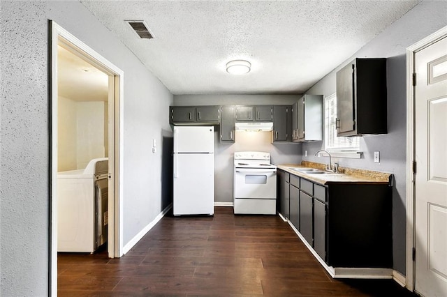 27 Pinewood Ct, New Orleans, LA 70114 - kitchen featuring white appliances, a sink, washer / dryer, under cabinet range hood, and light countertops