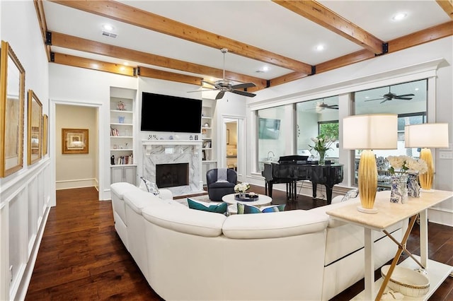 486 Cercle Du Lac, Covington, LA 70433 - living area featuring dark wood-type flooring, a premium fireplace, ceiling fan, beamed ceiling, and baseboards