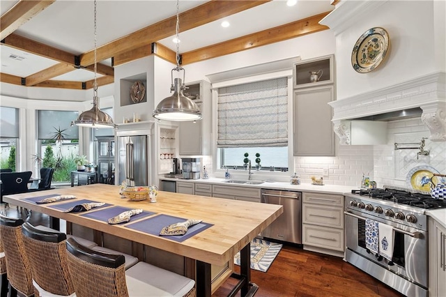 486 Cercle Du Lac, Covington, LA 70433 - kitchen with high quality appliances, light countertops, a sink, beam ceiling, and premium range hood