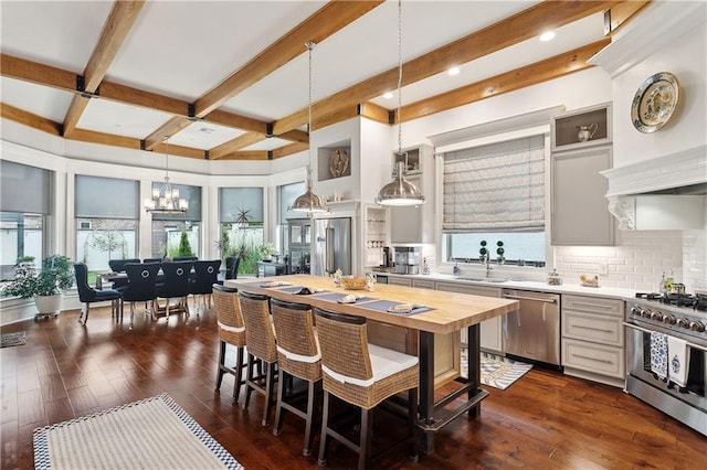 486 Cercle Du Lac, Covington, LA 70433 - kitchen featuring high quality appliances, a chandelier, beam ceiling, decorative backsplash, and a sink